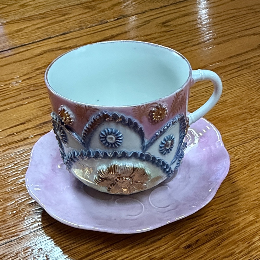 Antique Victorian Germany porcelain teacup with saucer. Pinks, gold and blue